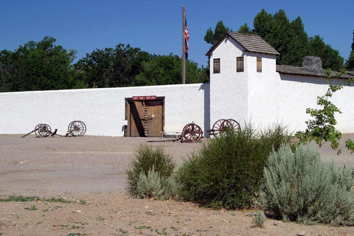 A white building with a flag on top of it