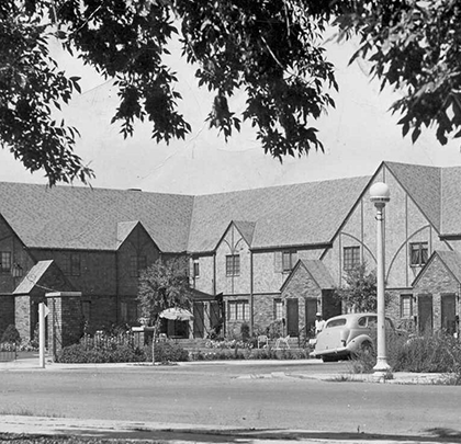 A black and white photo of a row of houses