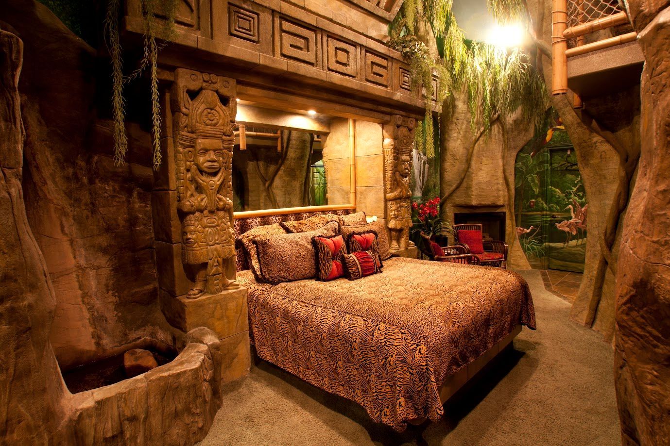 A bedroom in the jungle with a bed and a fireplace