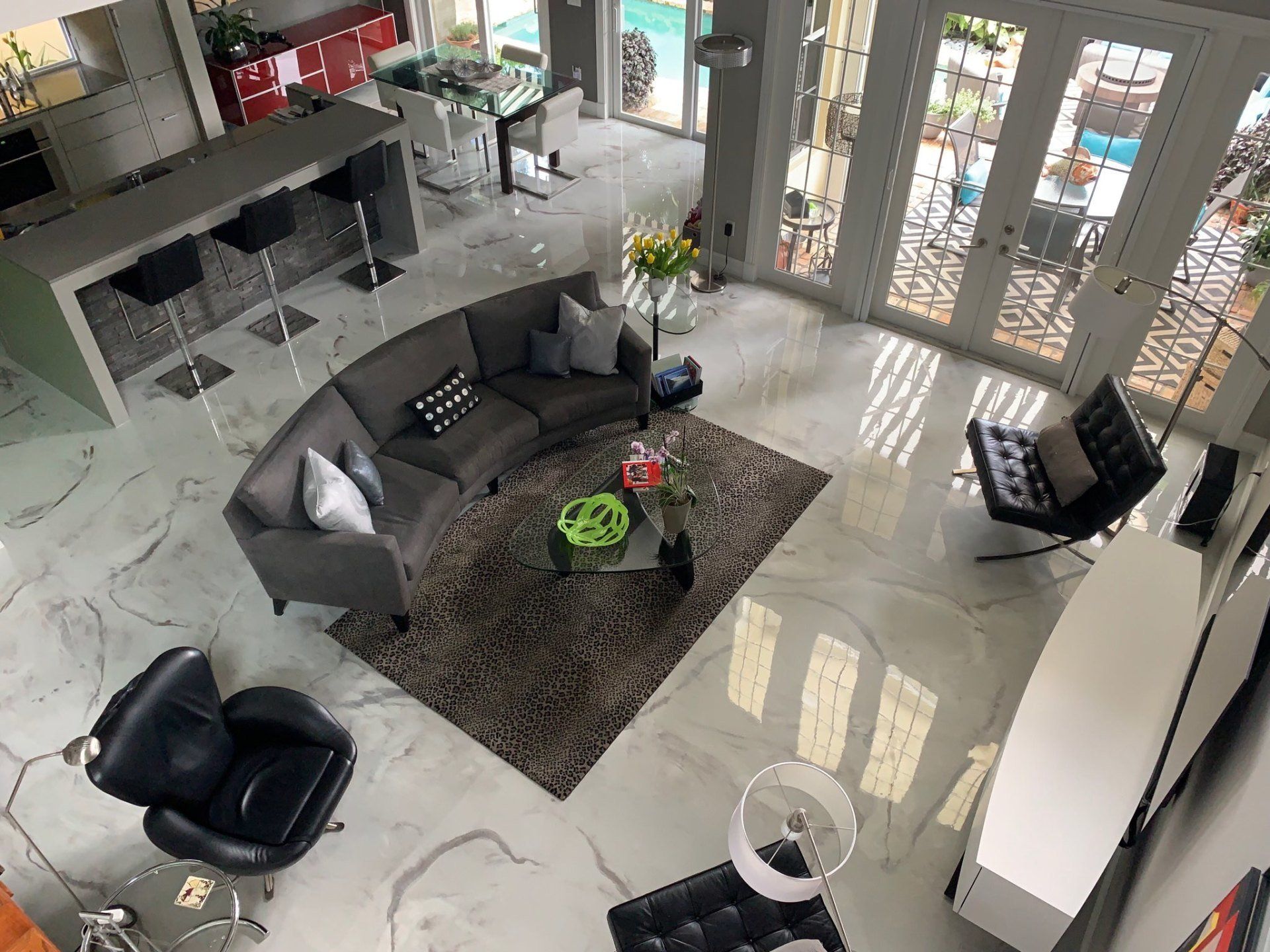 An aerial view of a living room with a couch and chairs