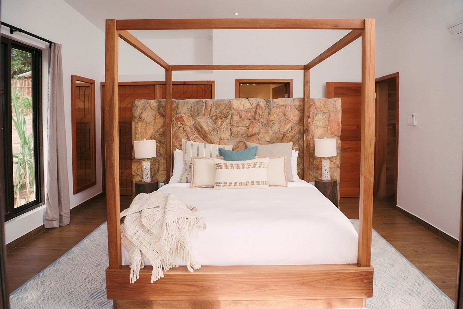 Luxurious four-poster king size bed in a Hidden Valley villa, designed for ultimate comfort.