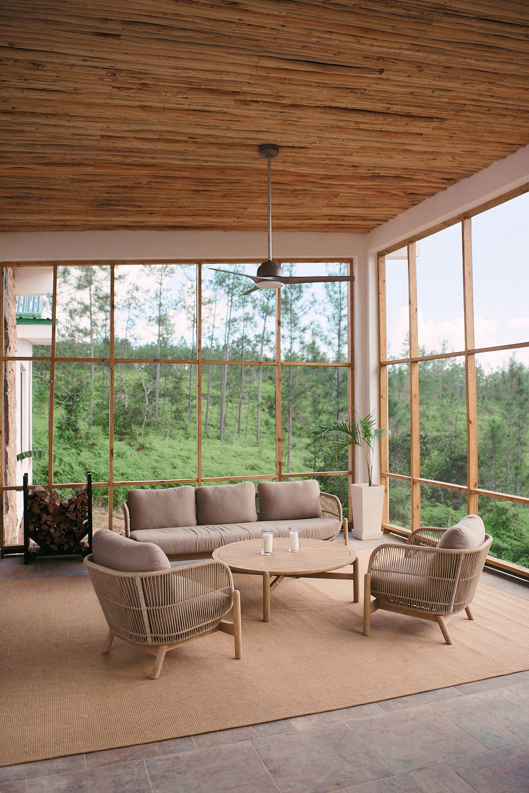 Comfortable seating area overlooking the pine forest at Hidden Valley Wilderness Lodge.