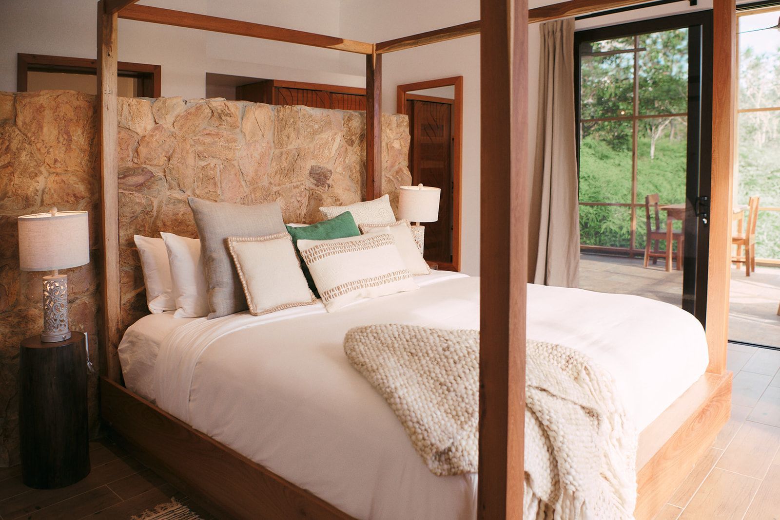 Luxurious four-poster king-sized bed in a Hidden Valley villa, designed for ultimate comfort.
