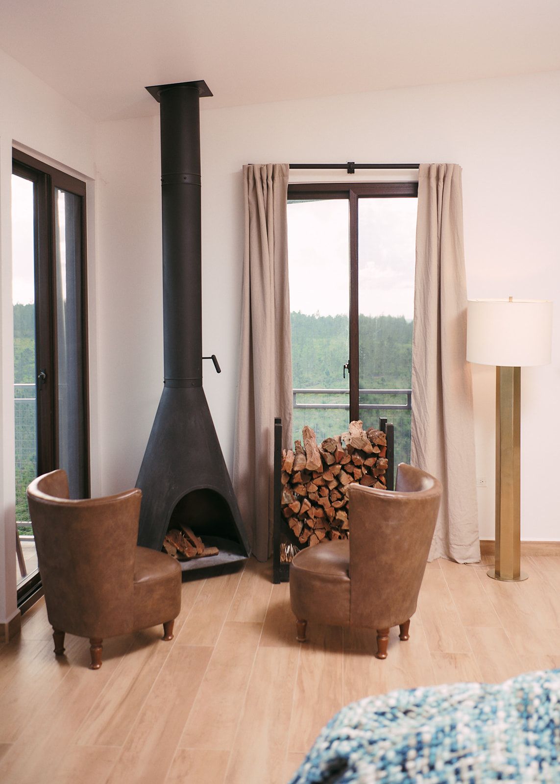Elegant room with cozy fireplace, leather furnishings, and plush bedding, perfect for a romantic escape.