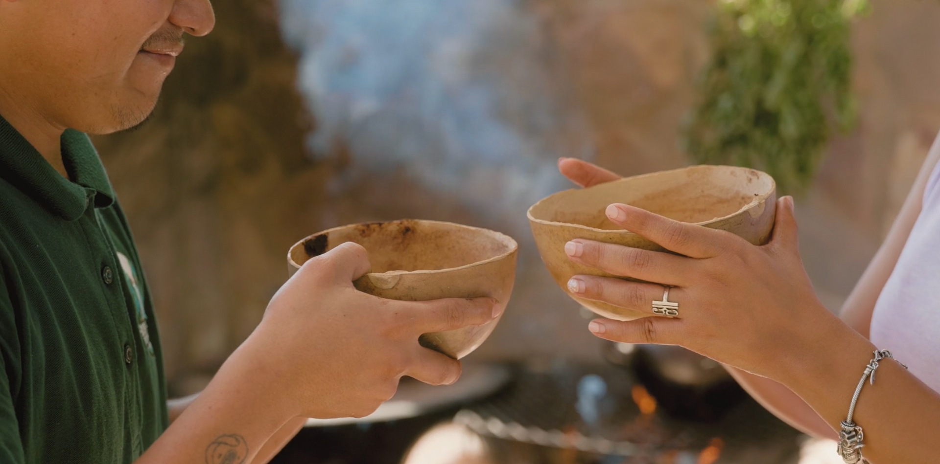 Sharing a traditional Maya cacao drink during a Chocolate Making Class, a cultural immersion experience.