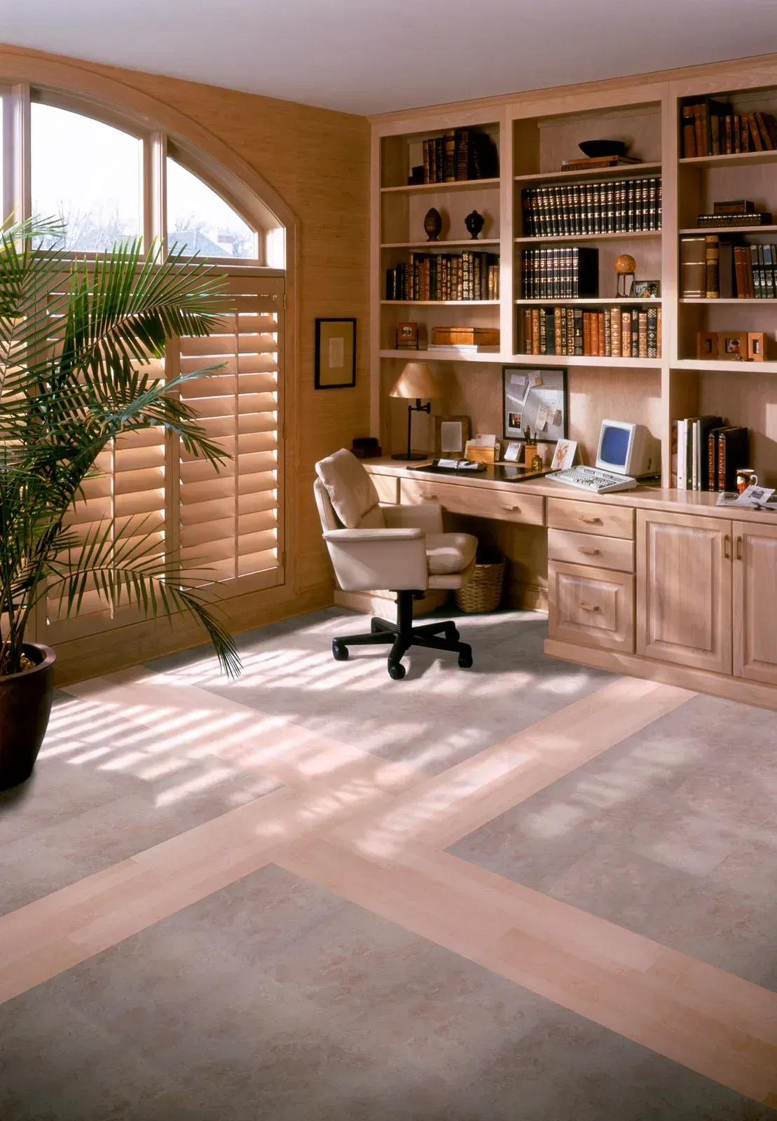 A home office with a desk and a chair