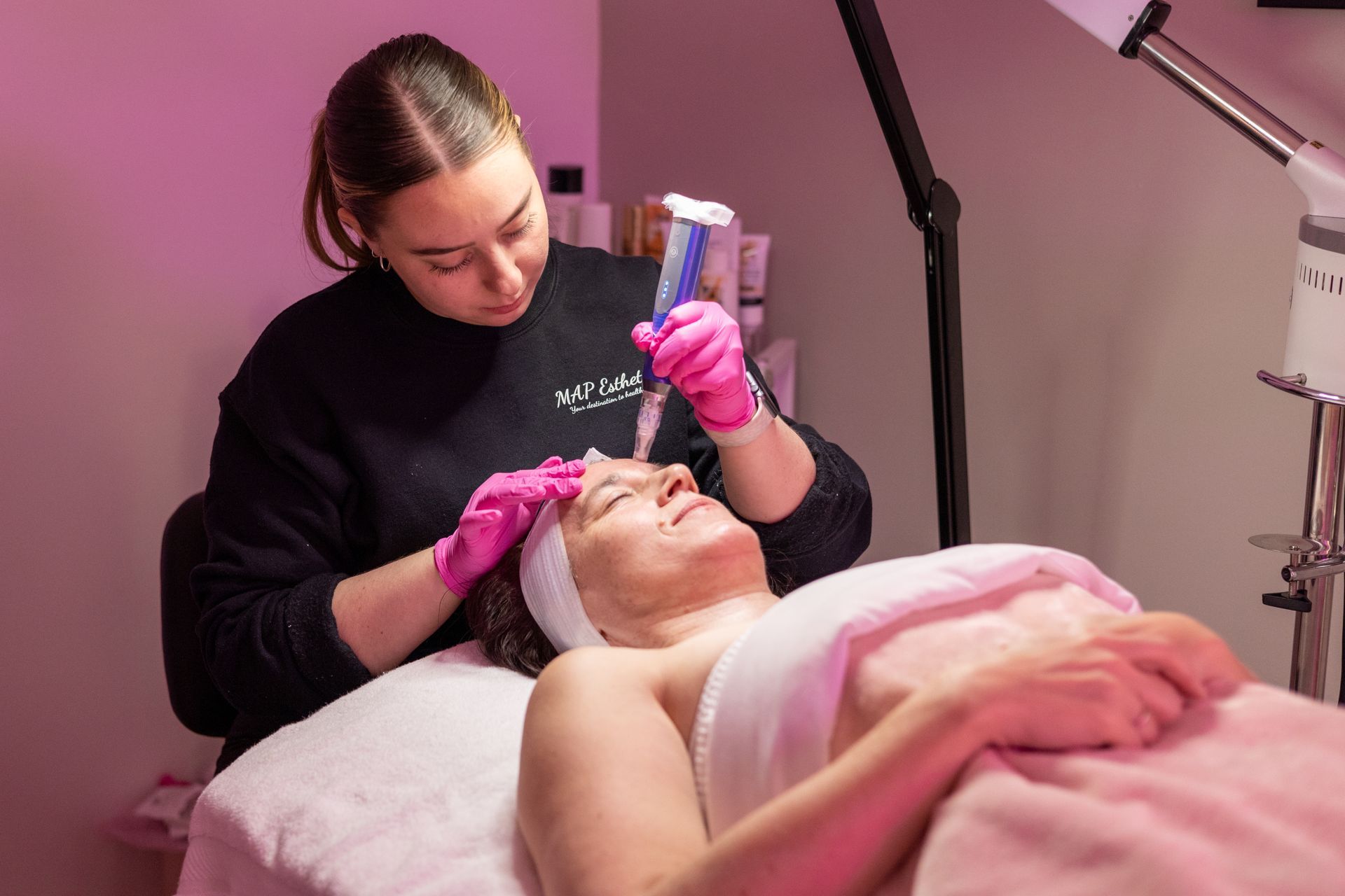 A man is getting a tattoo on his arm