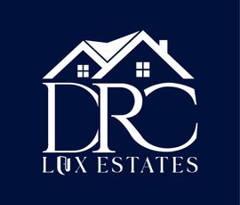 A dark blue logo for DRC Lux Estates, featuring a stylized house icon above the text.