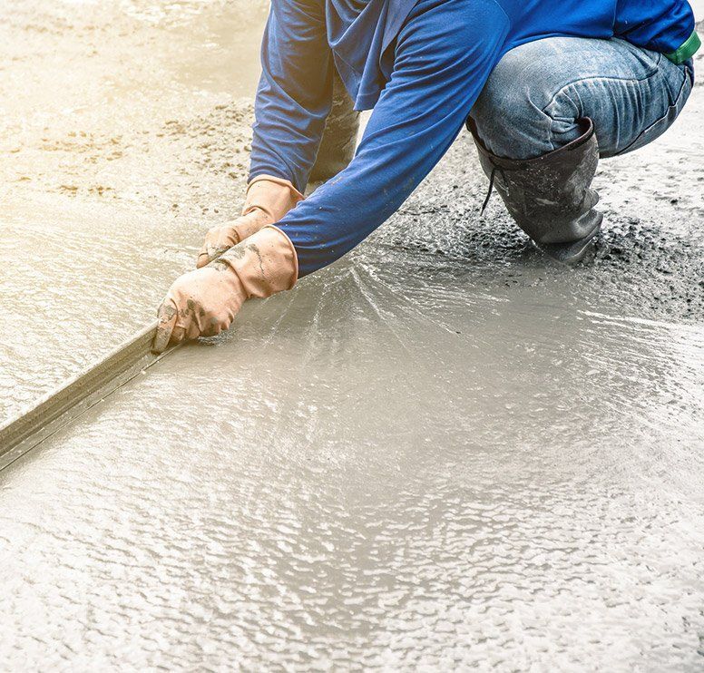 concrete contractor smoothing surface of concrete - Haley Concrete