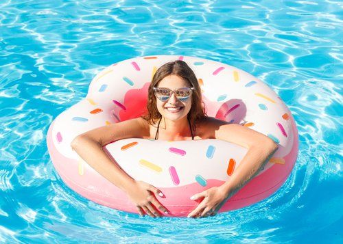 woman on float tube in pool