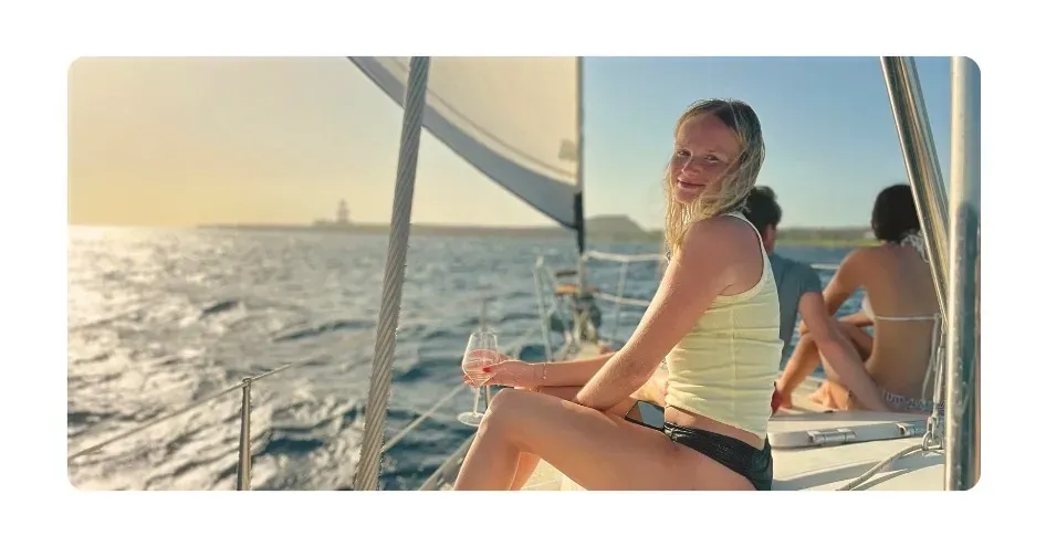 lady enjoying sunset cruise curacao on sailing yacht galaxie at sunset
