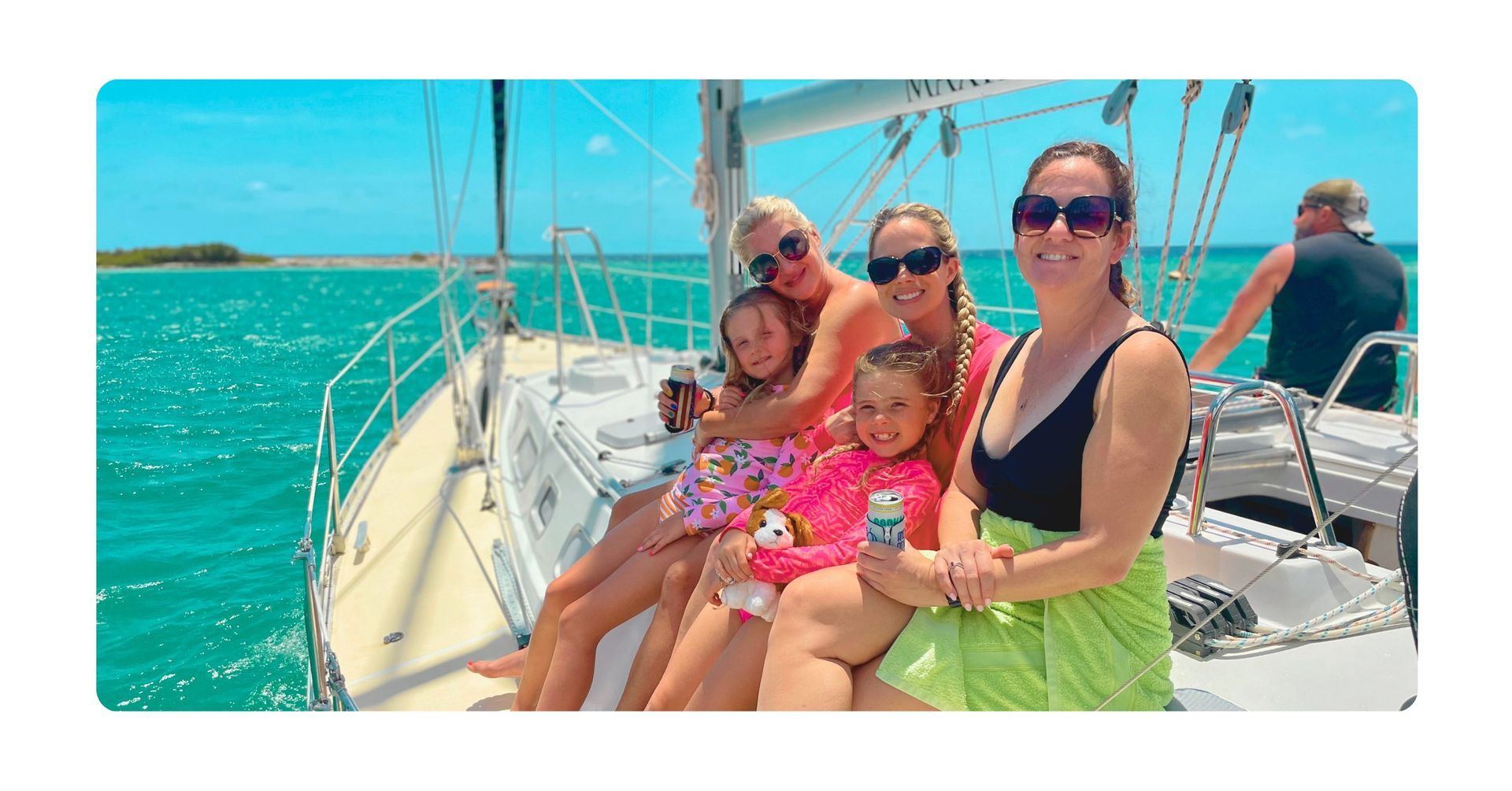 Happy guests with kids enjoying a Private Family Boat Tour Curacao on blue sea