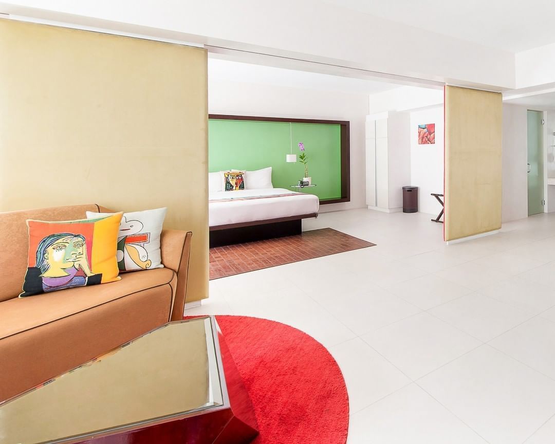 A living room with a couch and a bed