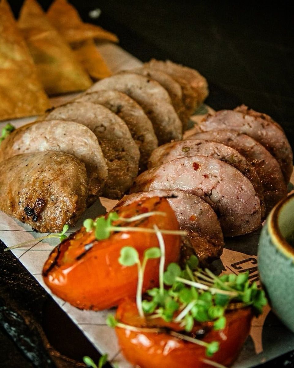 The Cartel Deli Butifarra and Criollo Sausage Platter.