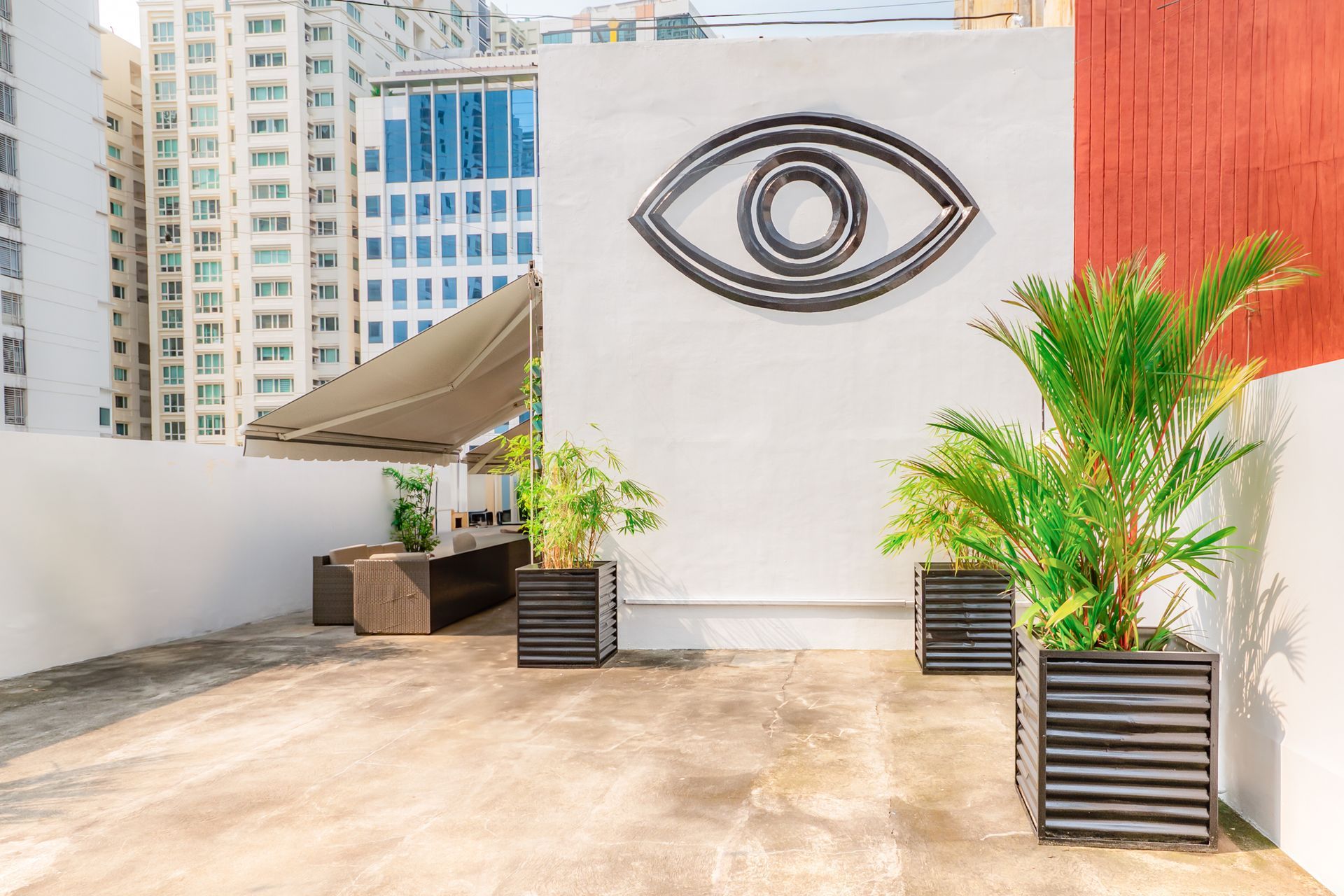 Rooftop lounge at Makati boutique hotel with modern outdoor furniture and city views