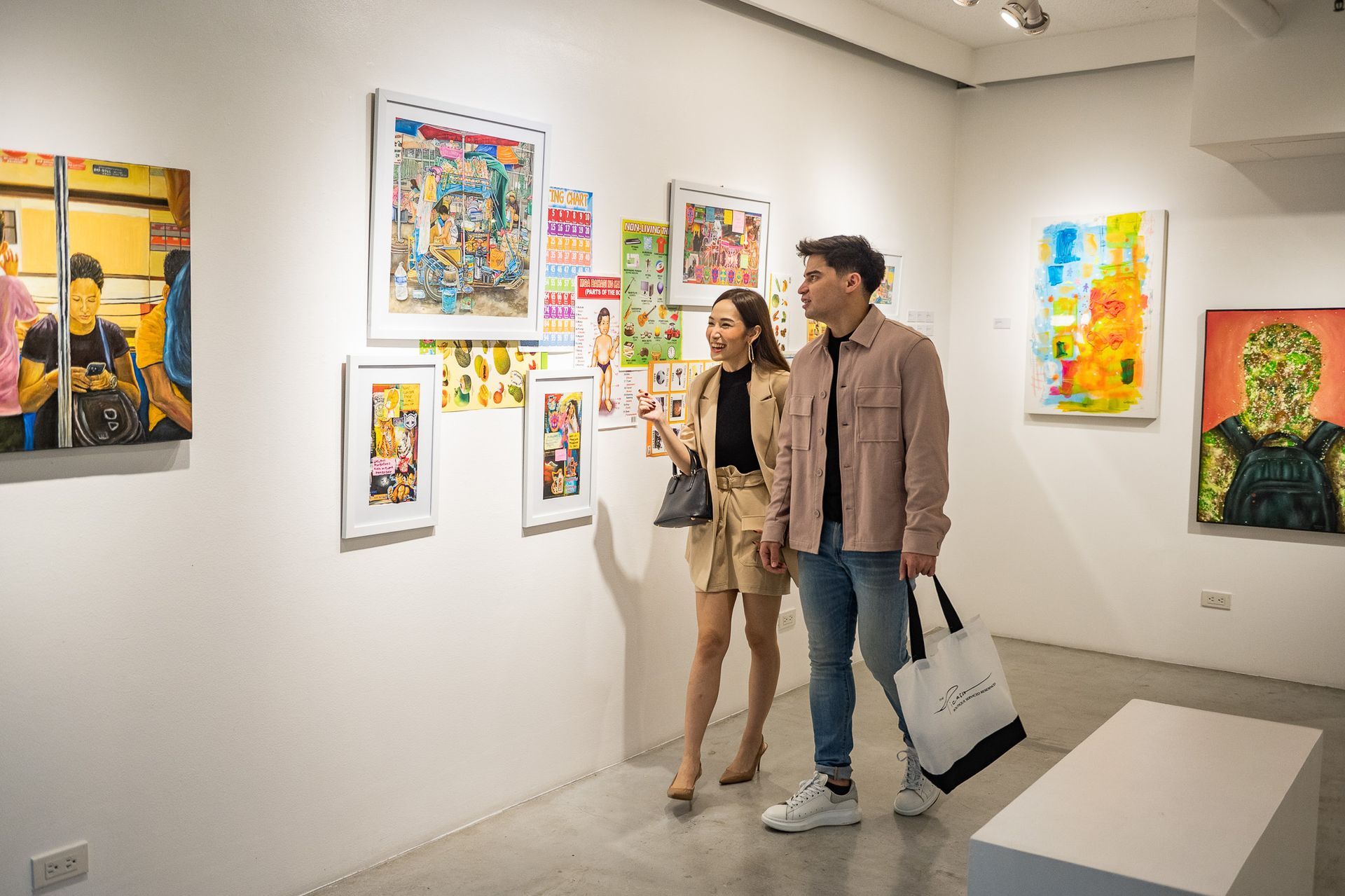 Couple appreciating the art at The Picasso Boutique Serviced Residences