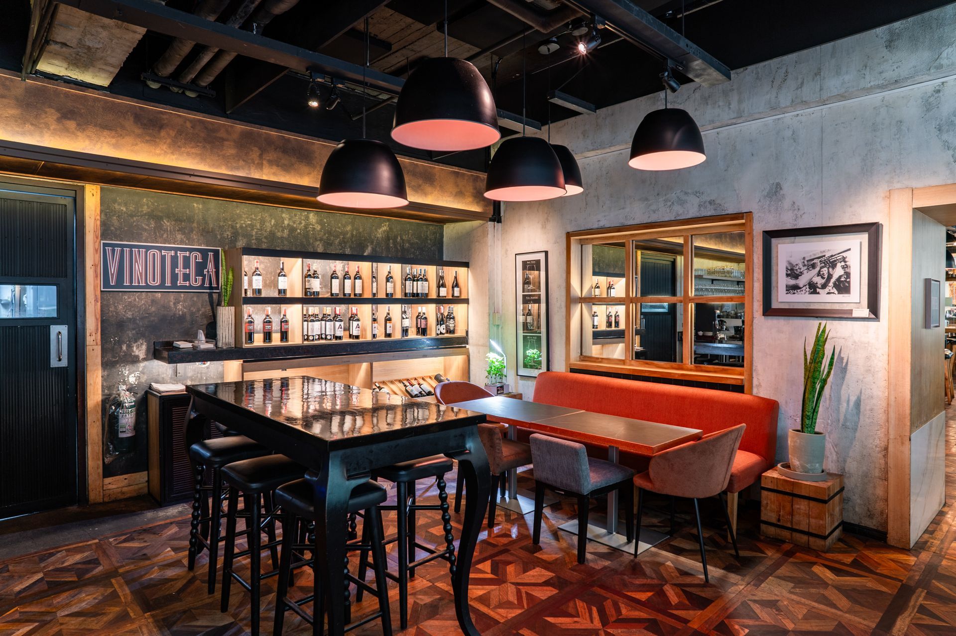 A restaurant with a lot of tables and stools