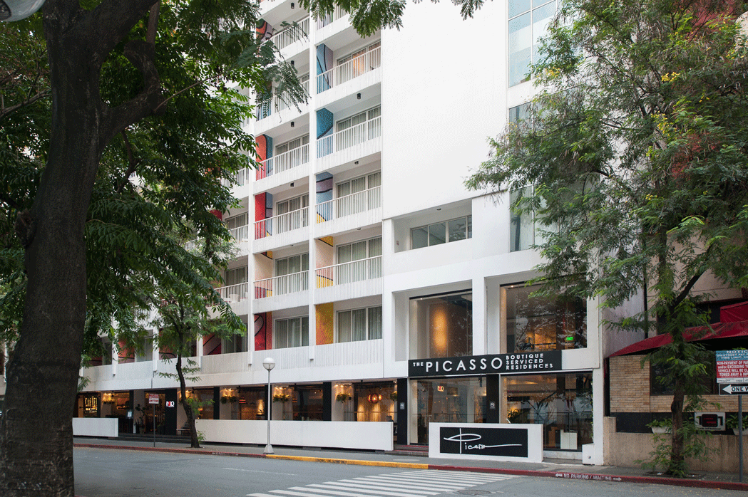 Exterior view of Picasso serviced residences hotel building in Makati with street-level retail