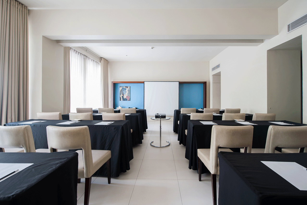 Stylish Malaga Studio room at boutique Makati hotel with modern furnishings and accent wall