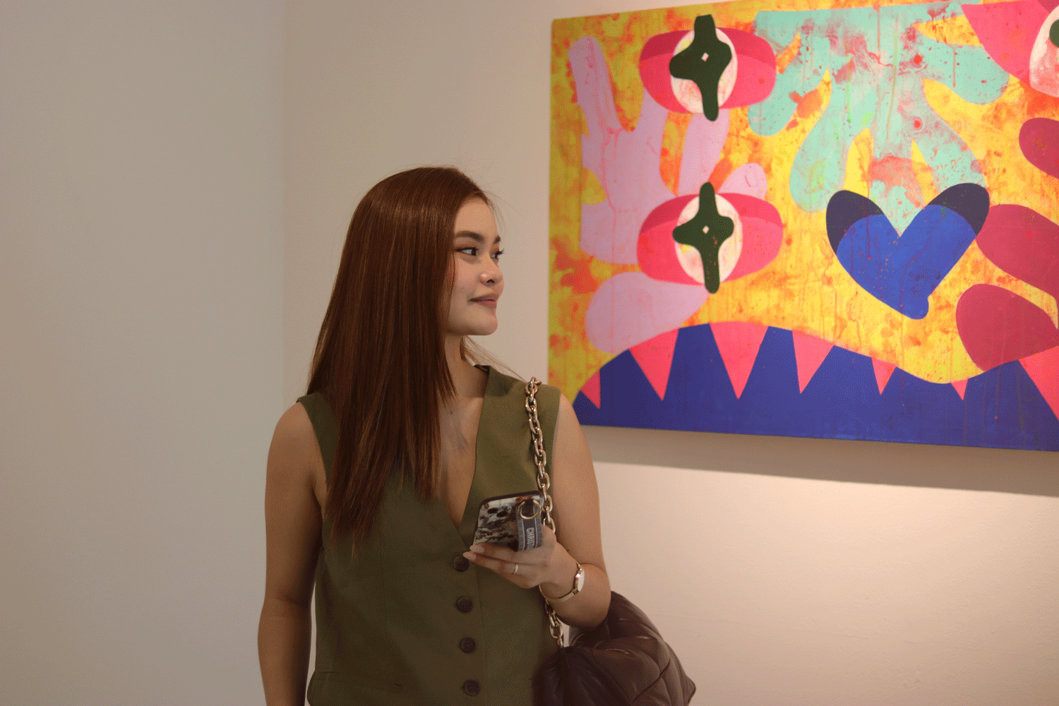 A woman enjoying the art at The Picasso Boutique Serviced Residences