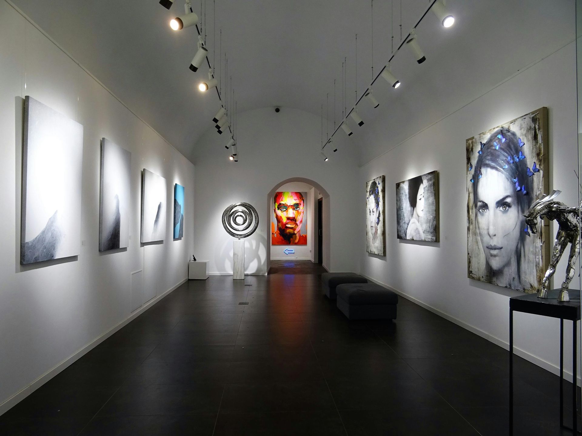 A modern gallery corridor inside the Yuchengco Museum, showcasing the rotating art exhibitions available for guests of nearby hotels to explore.