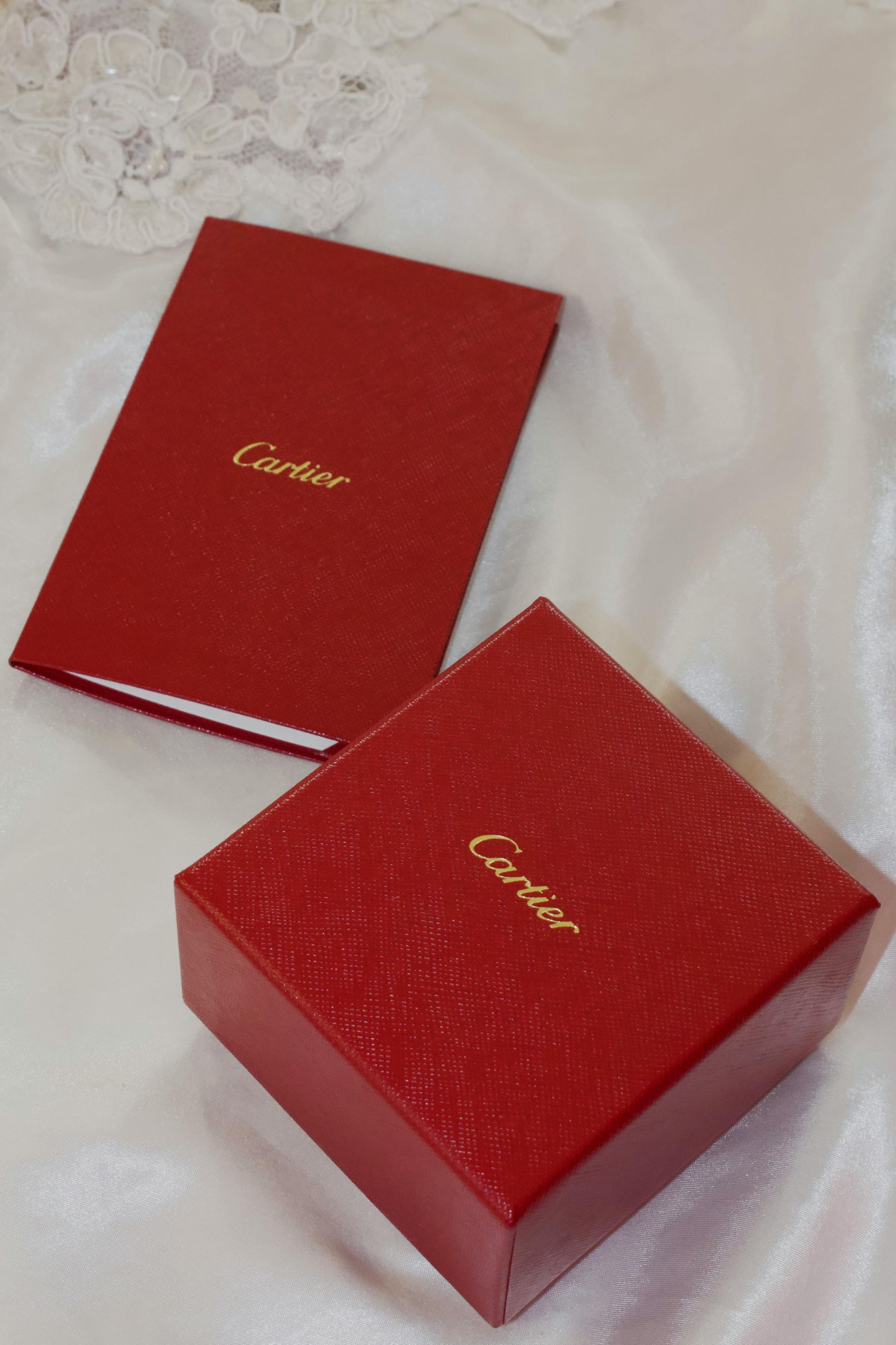 Luxury red jewelry boxes, symbolizing the high-end watch and accessory boutiques in Greenbelt, a premier shopping destination in Makati.
