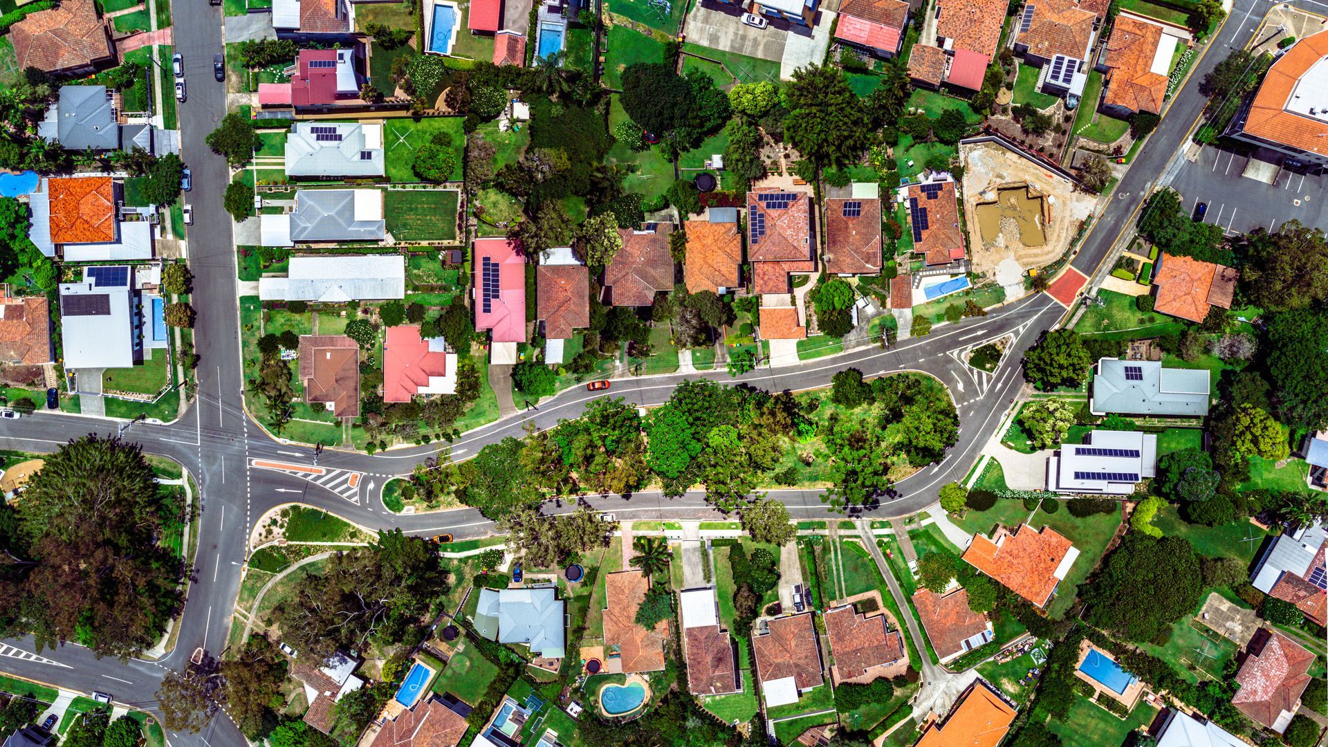 Aerial View of a Residential Neighborhood With Houses, Roads, and Trees — QA Oxley in Darra, QLD