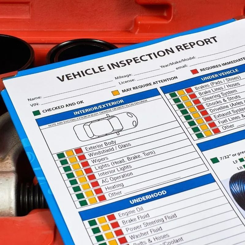 Vehicle Inspection Report, Partially Filled Out, on a Blue Clipboard With Tools in the Background — QA Oxley in Oxley, QLD