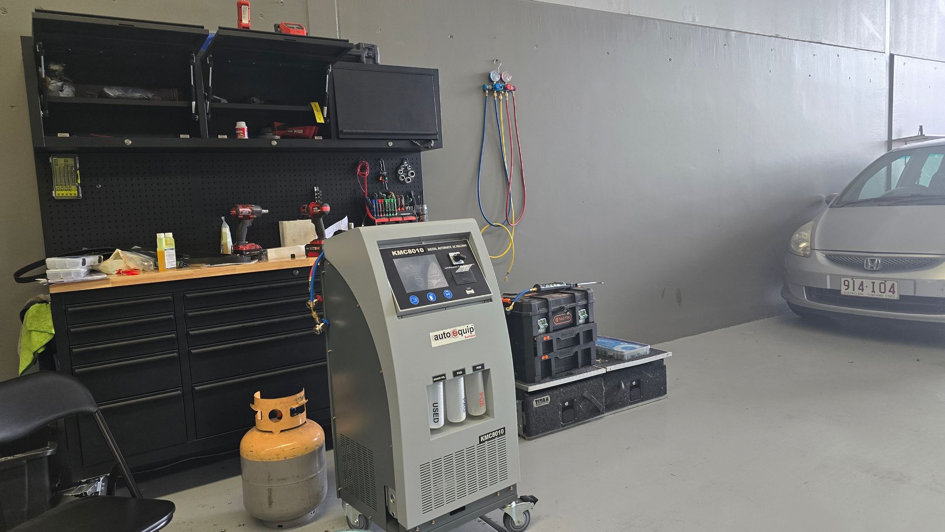 an Auto Repair Shop With a Car, Equipment, Tools, and a Service Machine — QA Oxley in Darra, QLD