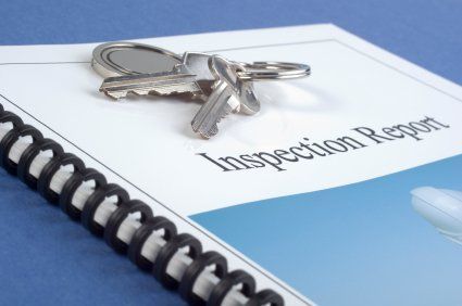 Brochure of Inspection Report, with keys on top.