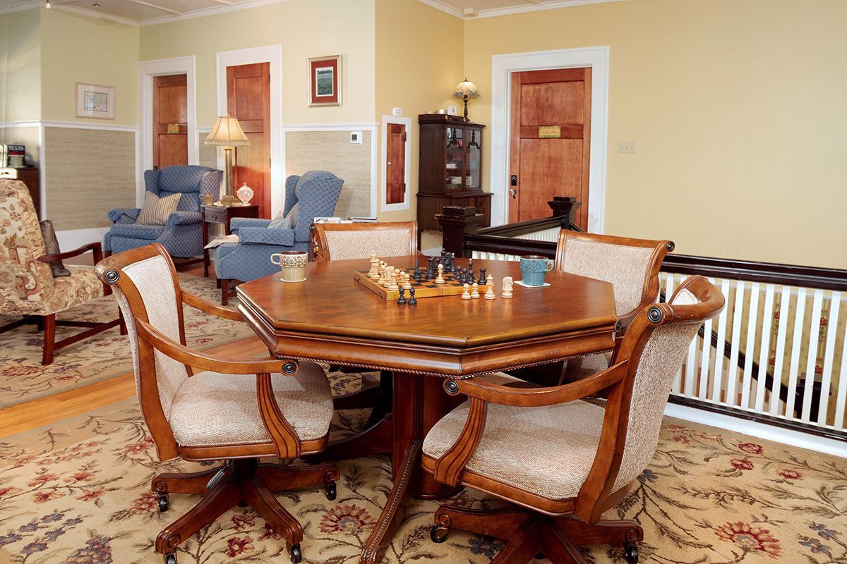 View of upstairs common area showing table and chairs available for games, conversations, working, or dining.