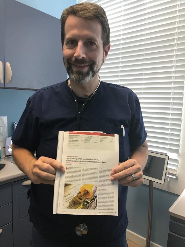 Dr. Norris showing JAMA magazine feature article