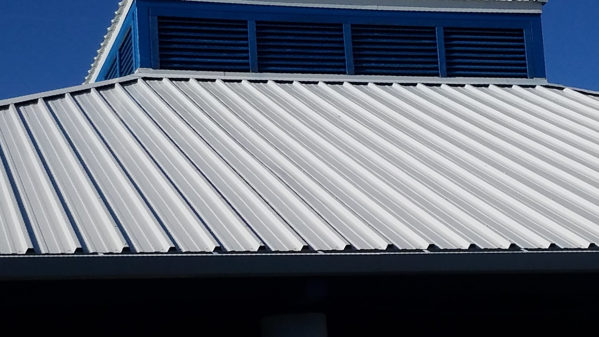 Roofing Materials Dealers — Corner of the House with Gutter in Rockledge, FL