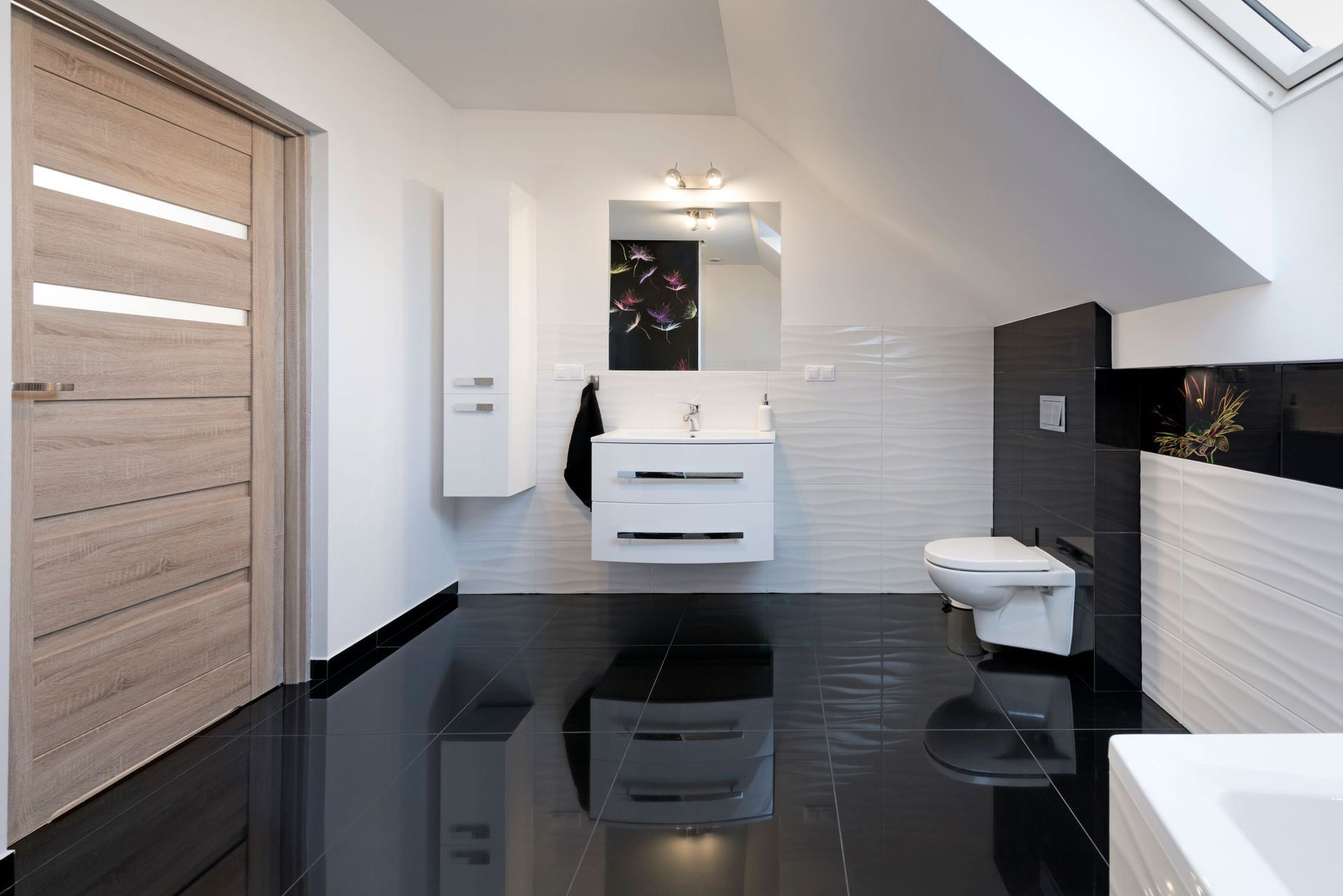 A bathroom with a toilet , sink and mirror