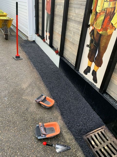 Verven betontegels, koudasfalt, fietsenrek