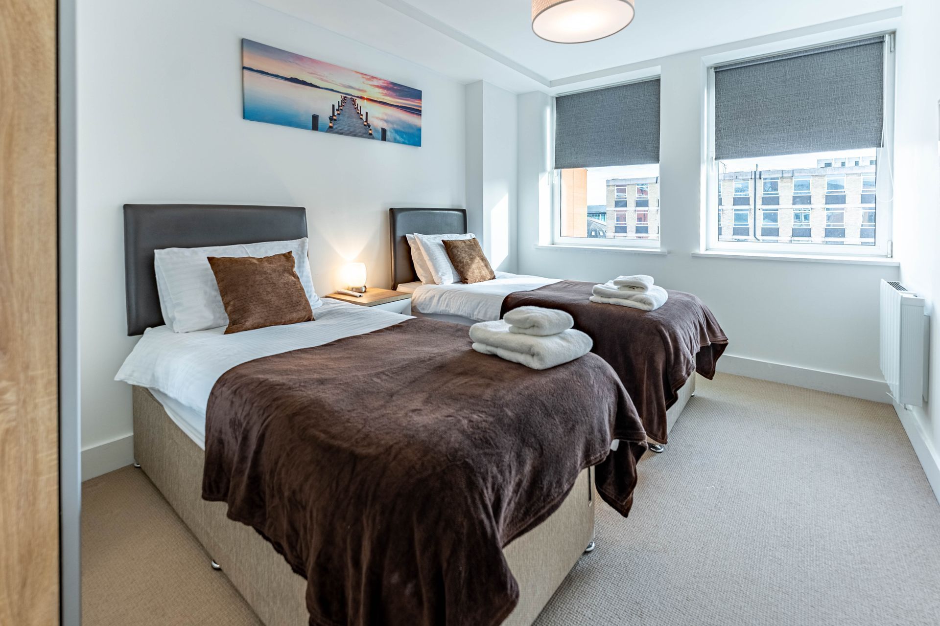 Sussex house bedroom with breakfast tray on the bed celador apartments