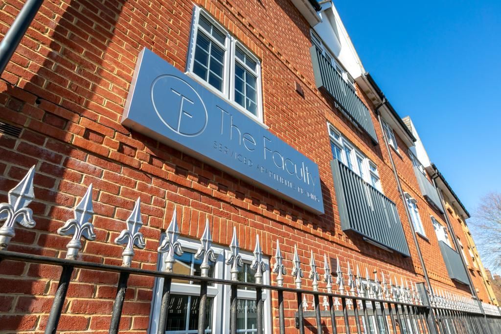 Red-brick building with a sign reading