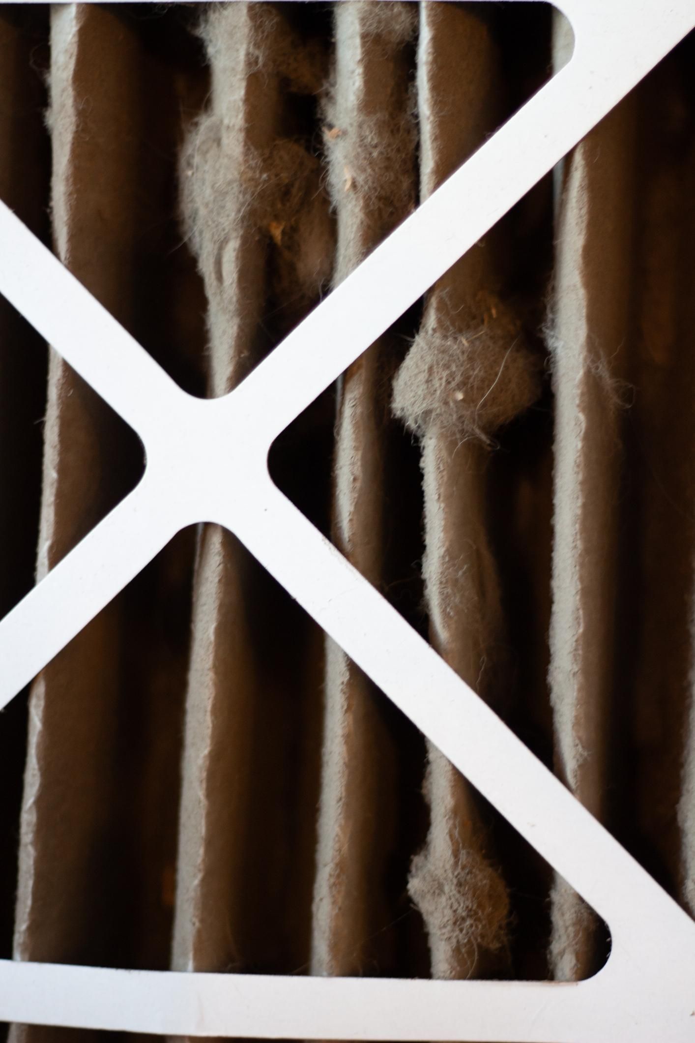 Extremely dirty HVAC air filter restricting airflow in Florida home