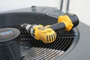 Drill On The HVAC Unit — Terrell, TX — System Control Air Conditioning & Heating