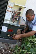 Man Repairing HVAC Unit — Terrell, TX — System Control Air Conditioning & Heating — Terrell, TX — System Control Air Conditioning & Heating