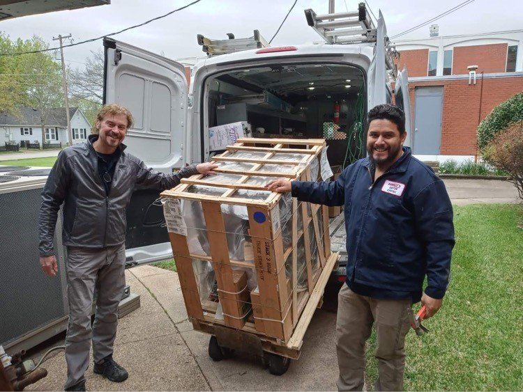 Two Man Holding To HVAC Unit — Terrell, TX — System Control Air Conditioning & Heating