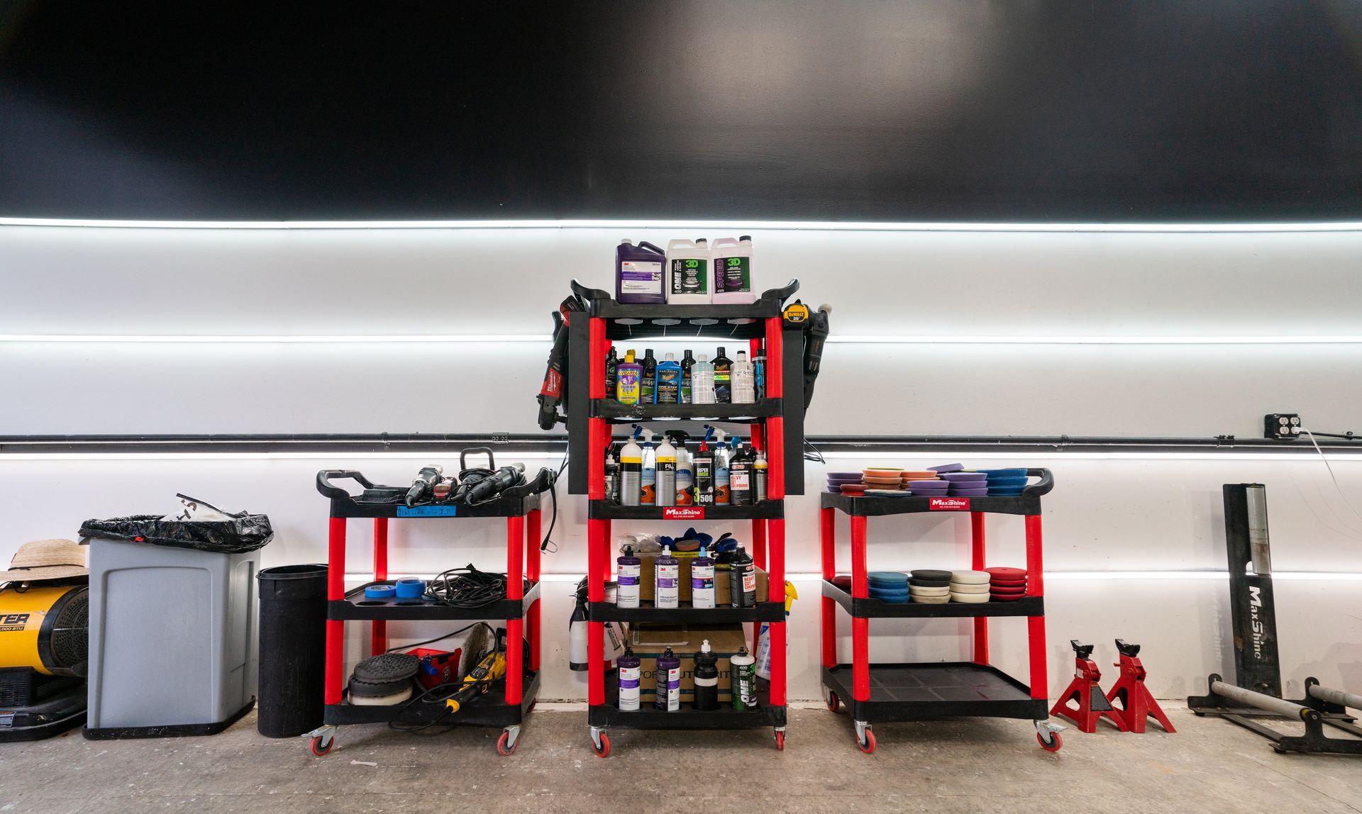 A garage filled with lots of tools and shelves.