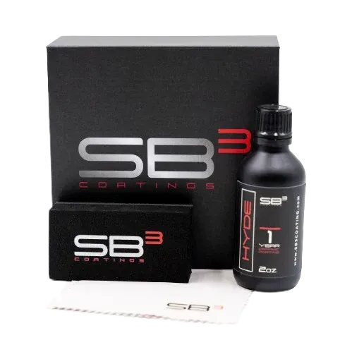 A bottle of sb3 coatings sits next to a box