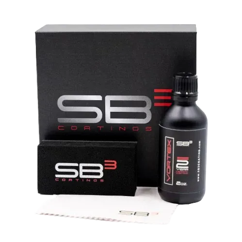 A bottle of sb3 coatings sits next to a box