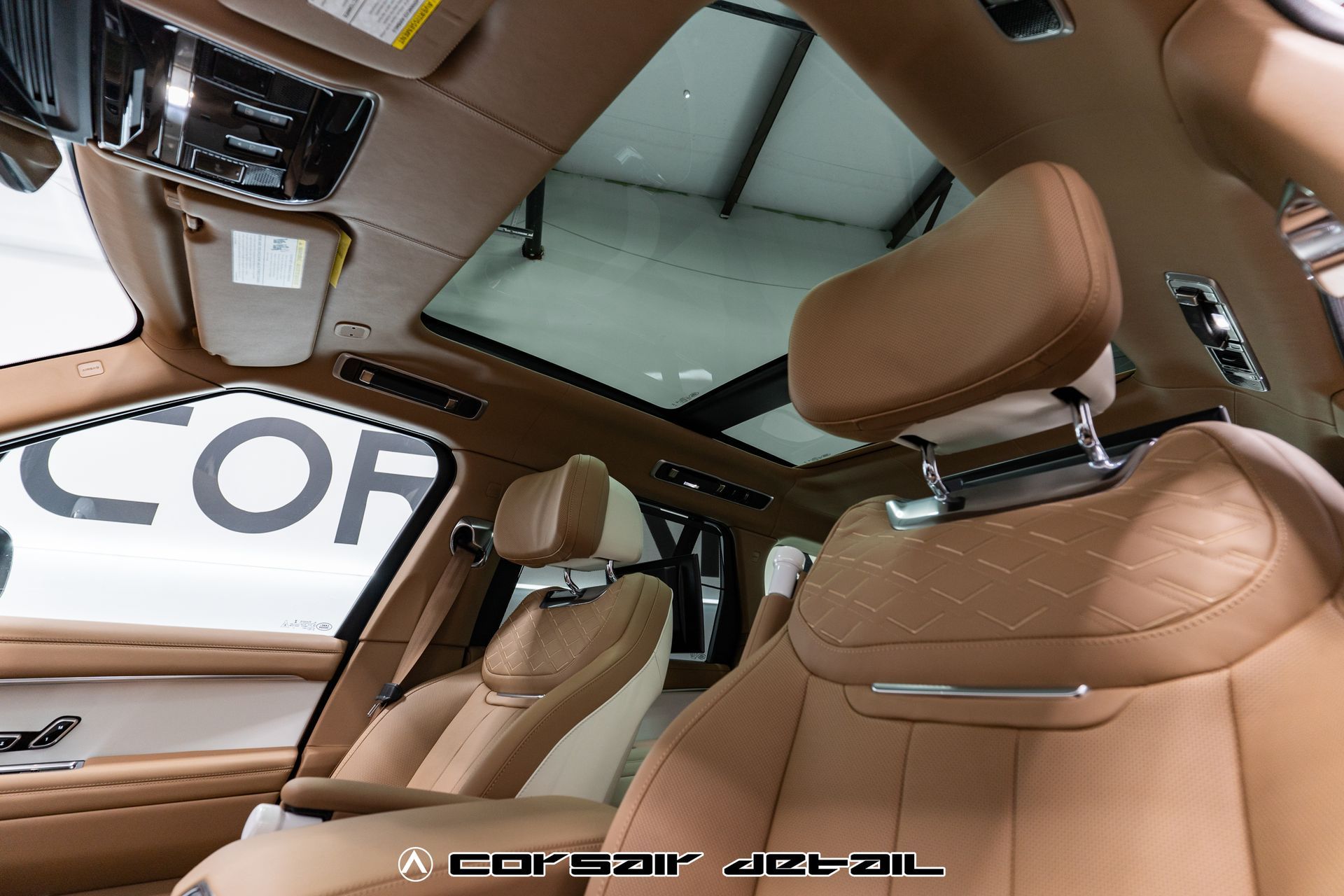 The inside of a car with the word cor on the roof