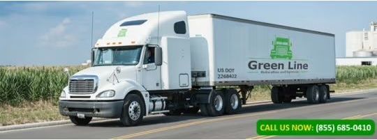 A white Green Line semi-truck driving on a paved road, with green accents and logo. The phone number (855) 685-0410 is displayed.