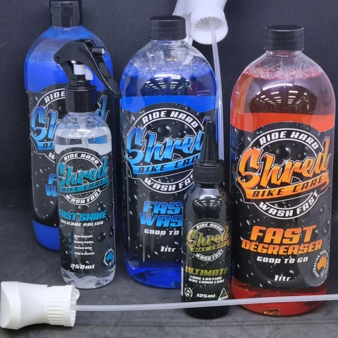 Several bottles of shred cleaning products are sitting on a table — Trinity Cycle Works In Cairns City, QLD