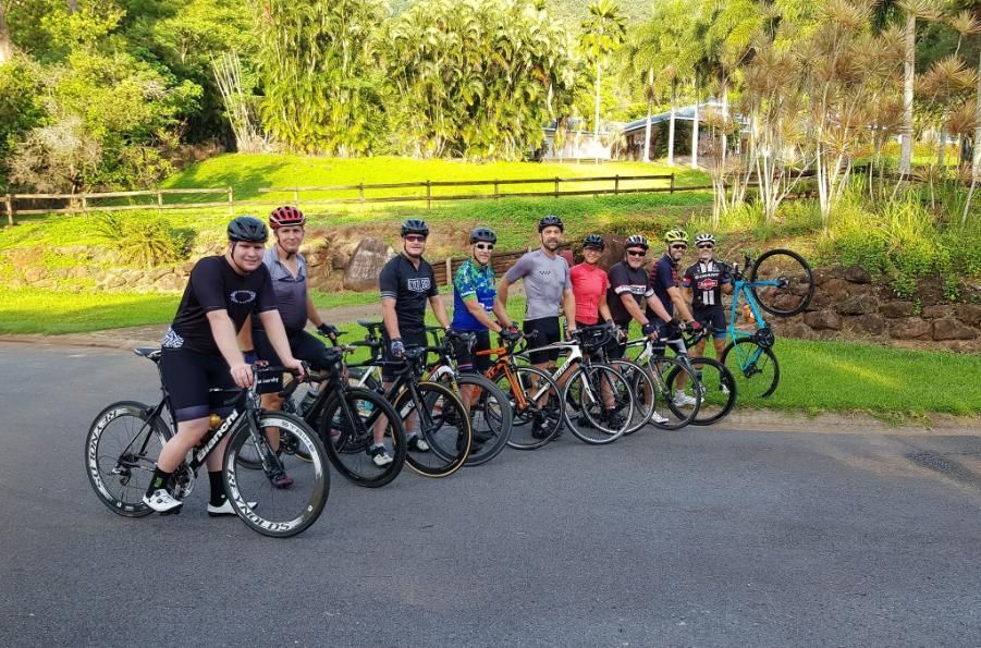A Group Of People Are Standing Next To Each Other On Bicycles — Trinity Cycle Works In Cairns City, QLD