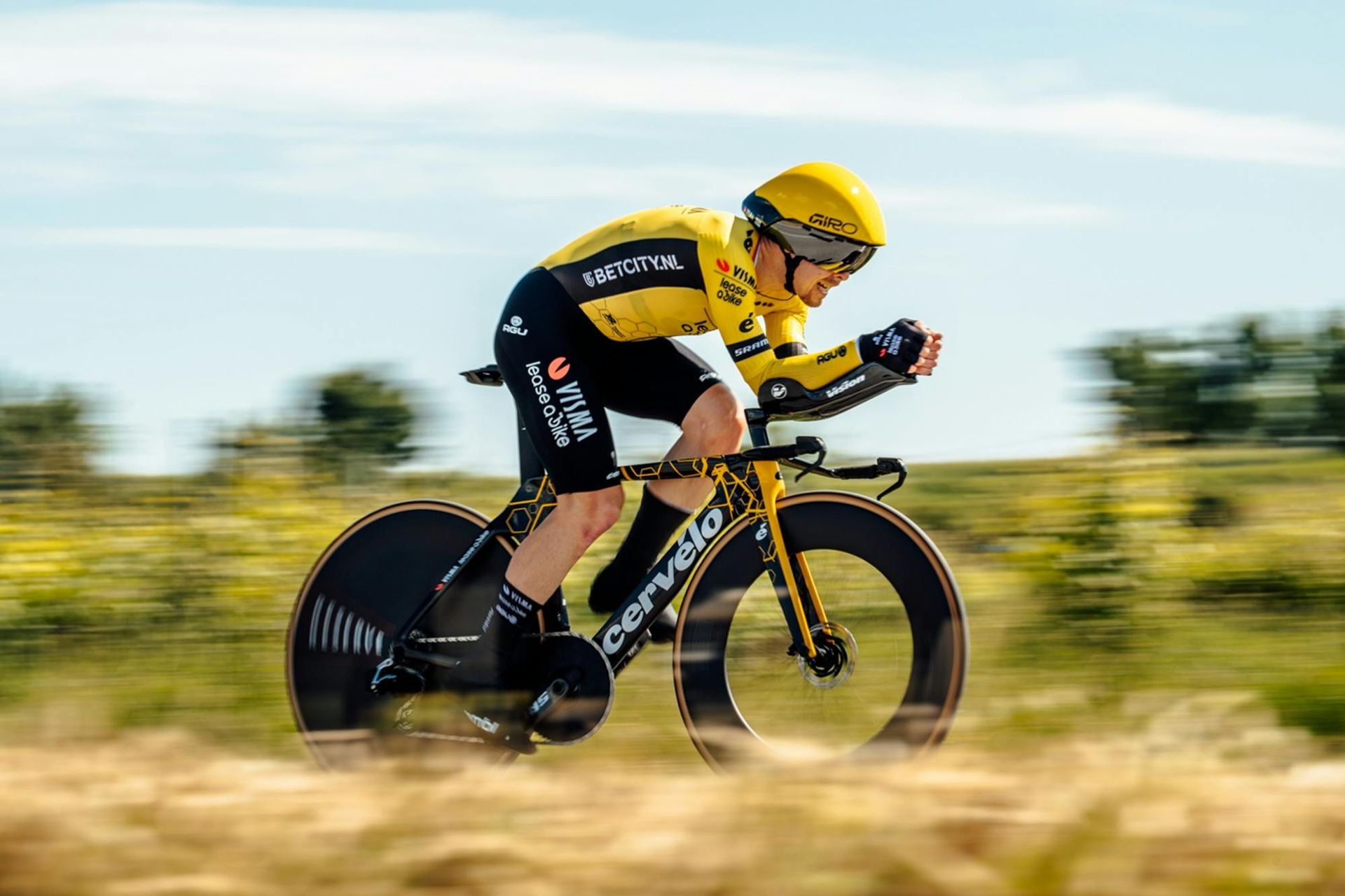 A Man Is Riding A Bike On A Dirt Road — Trinity Cycle Works In Cairns City, QLD