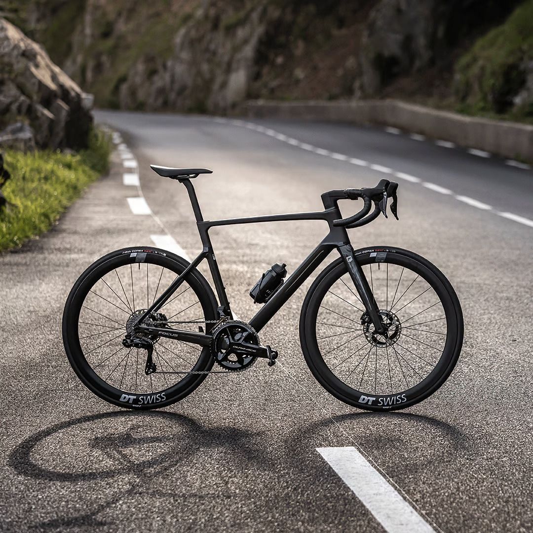 A Black Bicycle Is Parked On The Side Of A Road — Trinity Cycle Works In Cairns City, QLD